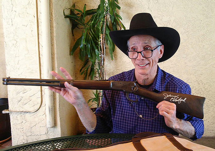 Johnny Crawford Autographing a Replica of the Rifleman rifle that was created at BountyHunterSpecial.com